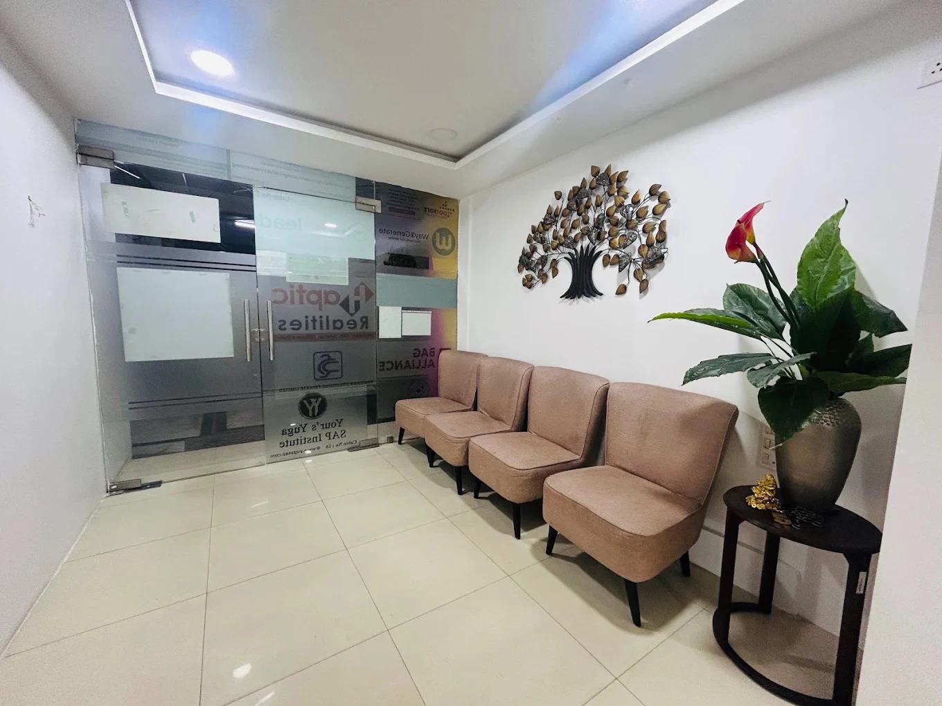 Office reception with seating and a decorative plant